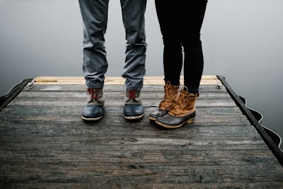 pair of brown boots leg google meet background