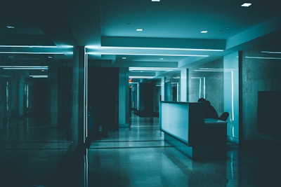 white wooden desk on hallway inside building