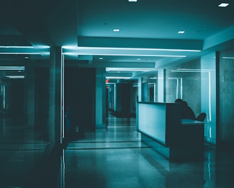 white wooden desk on hallway inside building