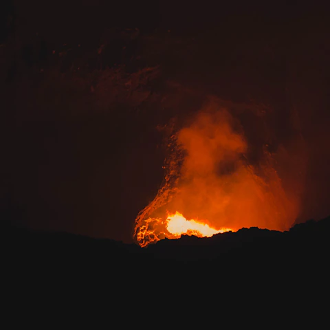 A dramatic, fiery Hellfire game scene with characters battling amidst molten lava and dark shadows.