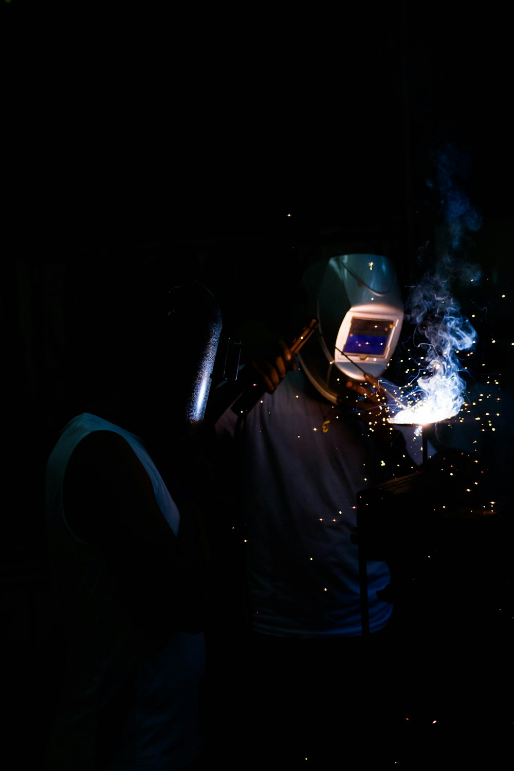 man welding and wearing mask