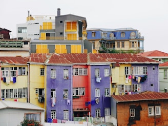 assorted-color concrete buildings under white skies