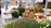 A vibrant display of colorful potted plants at a bustling outdoor market in Guadalajara.