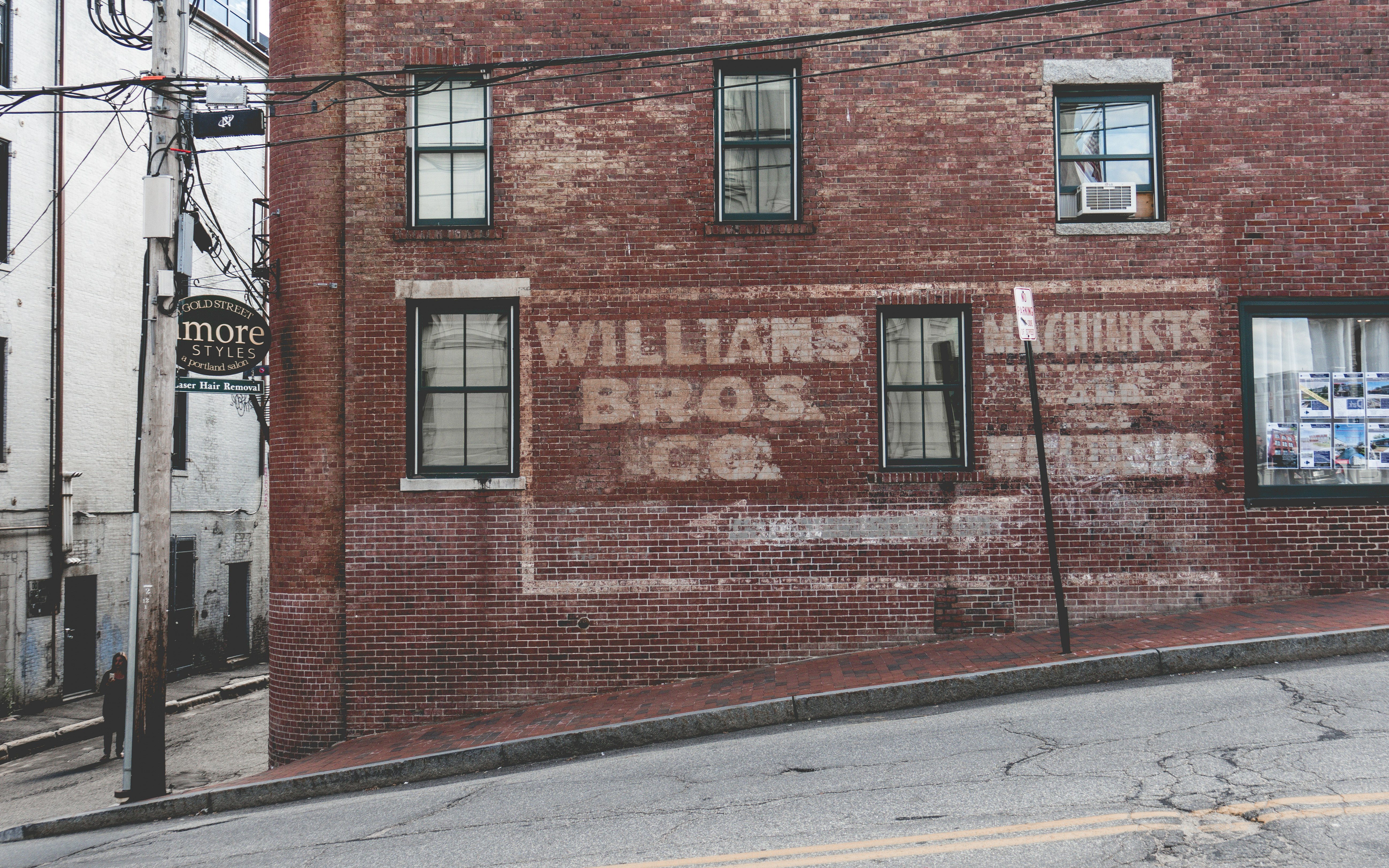 brown concrete building beside road