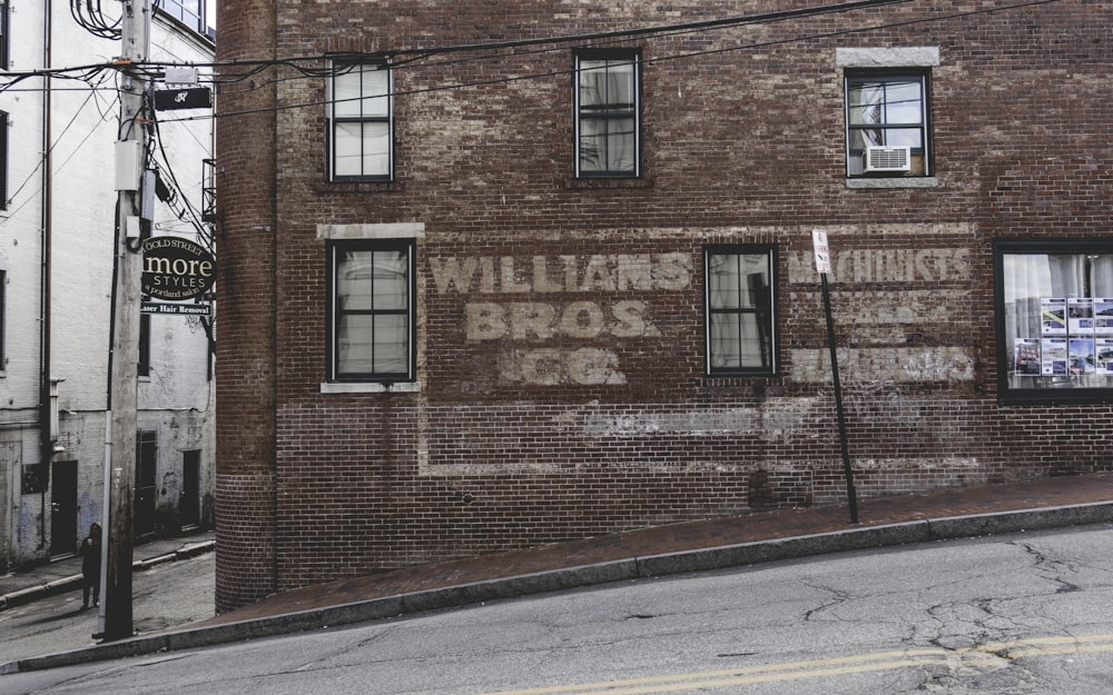 brown concrete building beside road