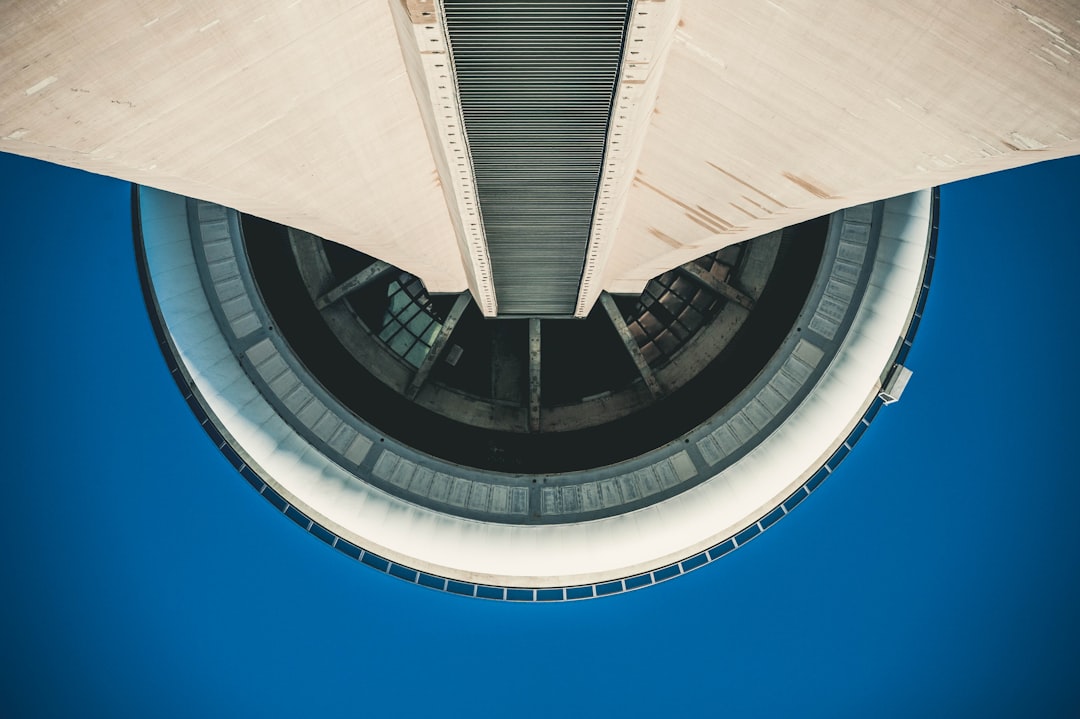 low angle photography of gray high-rise building