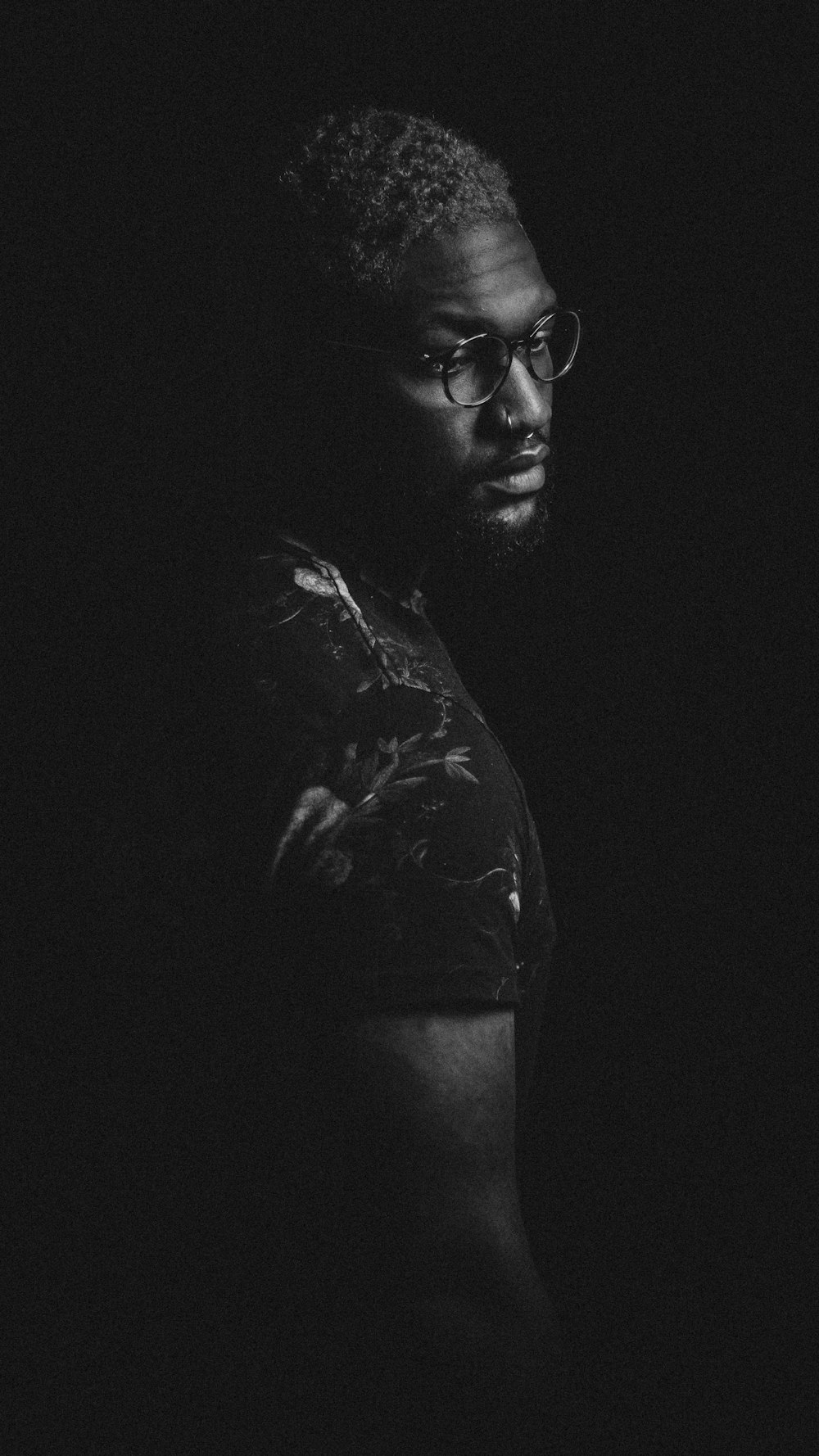 grayscale photo of man in eyeglasses