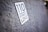 A close-up of a textured surface with a sticker that reads '110 Street Love.' The focus is on the sticker while the background is slightly blurred.