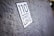A close-up of a textured surface with a sticker that reads '110 Street Love.' The focus is on the sticker while the background is slightly blurred.