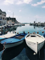 A scenic view of various boats docked at a harbor.