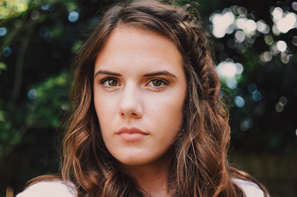 selective focus photography of woman's face