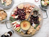 flat lay photography of sliced apples, sausages, chips and brown sauce