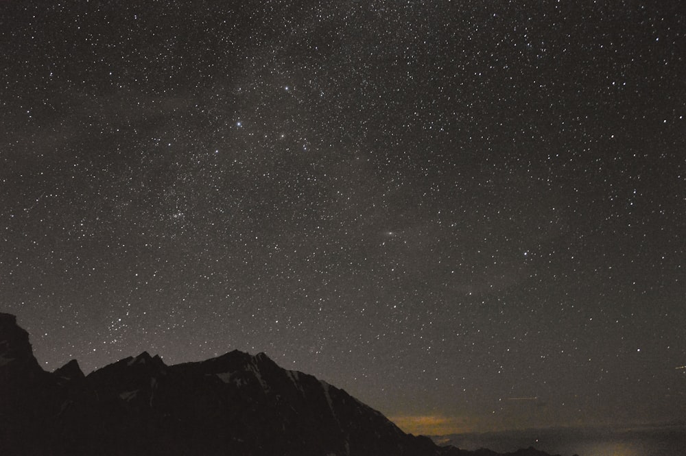 silhouette of mountain under gray sky