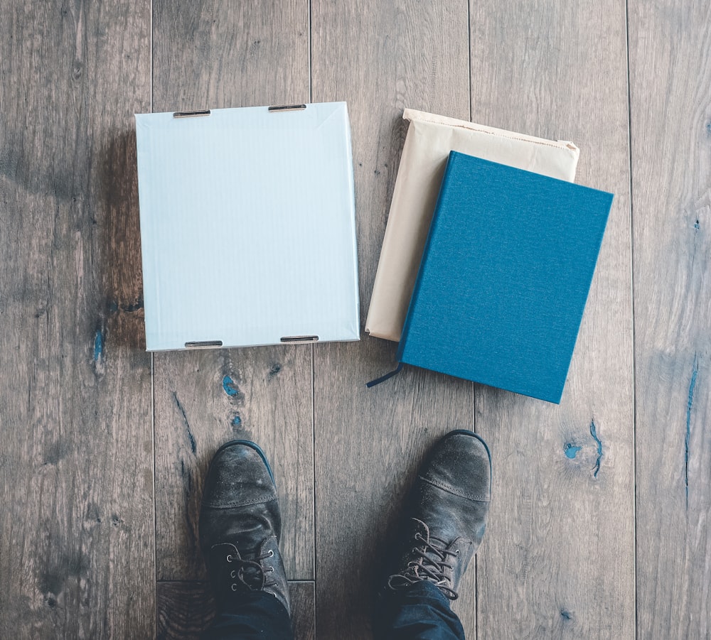 person standing near three boxes