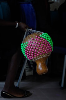 Portrait of a master musician from Montes de María holding a maraca.