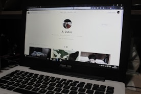 Close-up of a laptop screen showing a digital company profile on the kair global portal