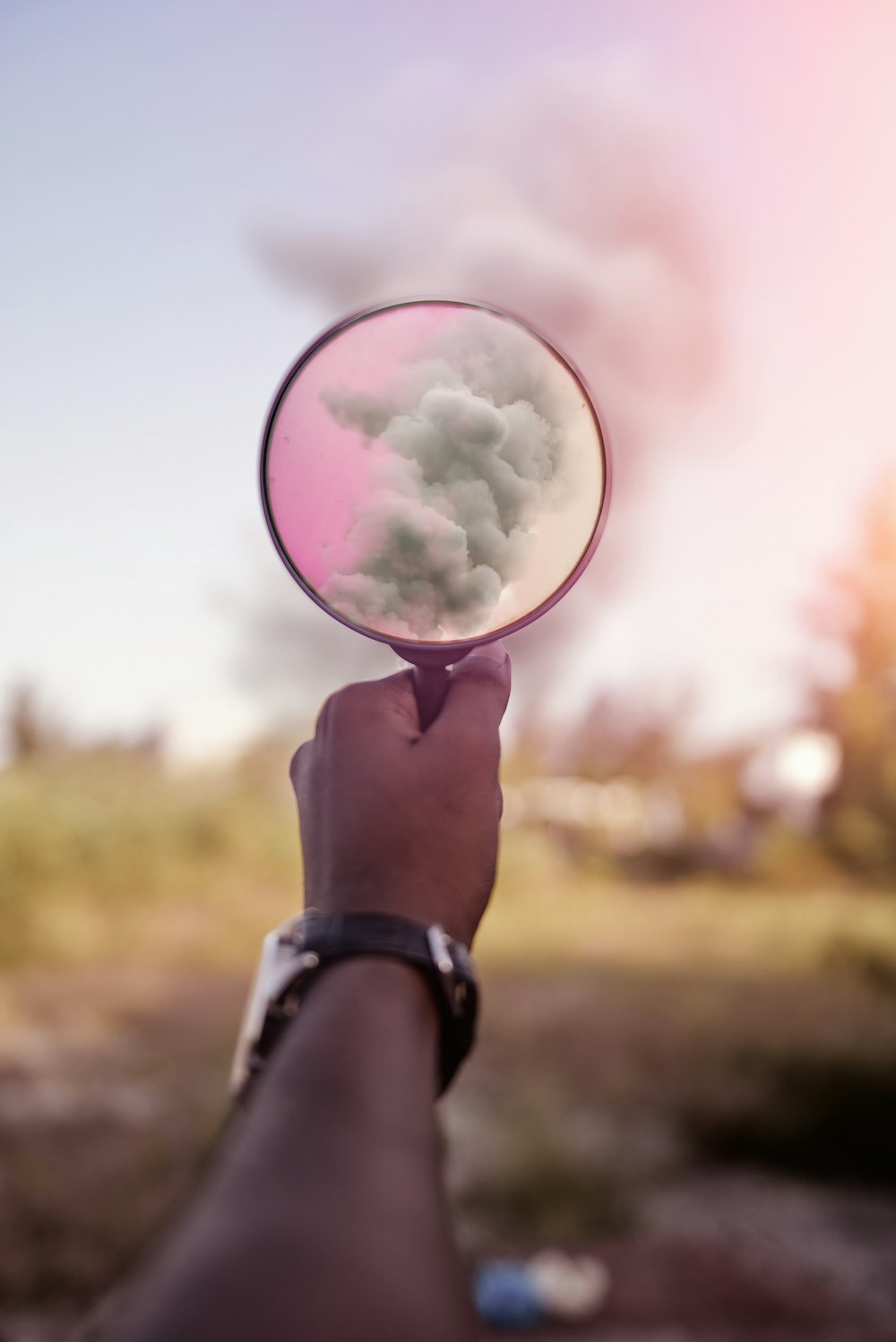 magnifying glass showing smoke