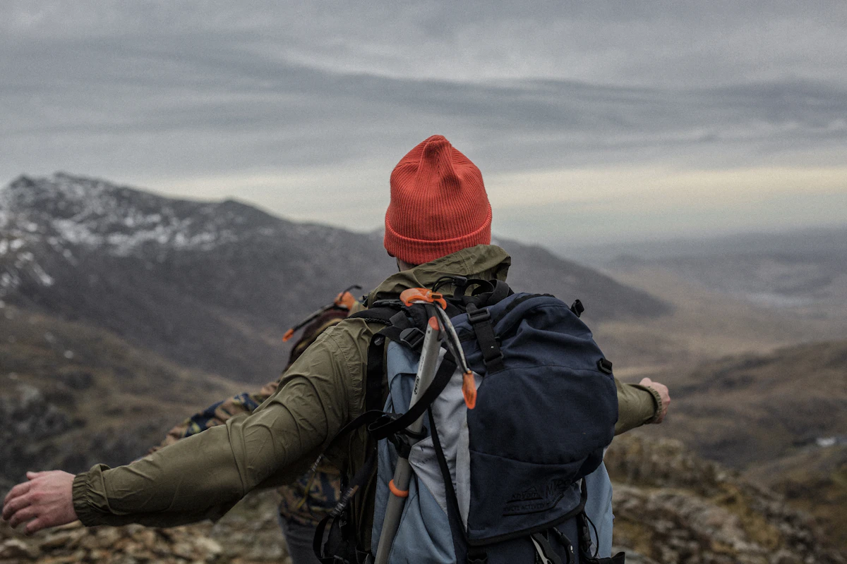Figure on a ridgeline in a technical jacket