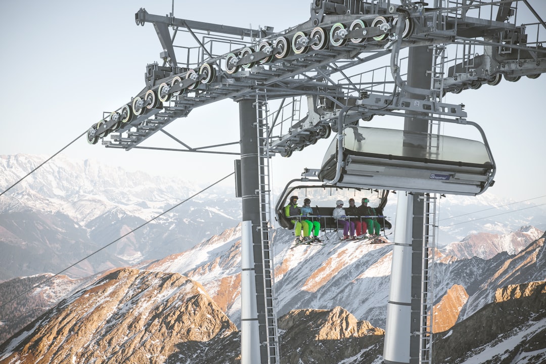group of people riding white ski lift, Kaprun