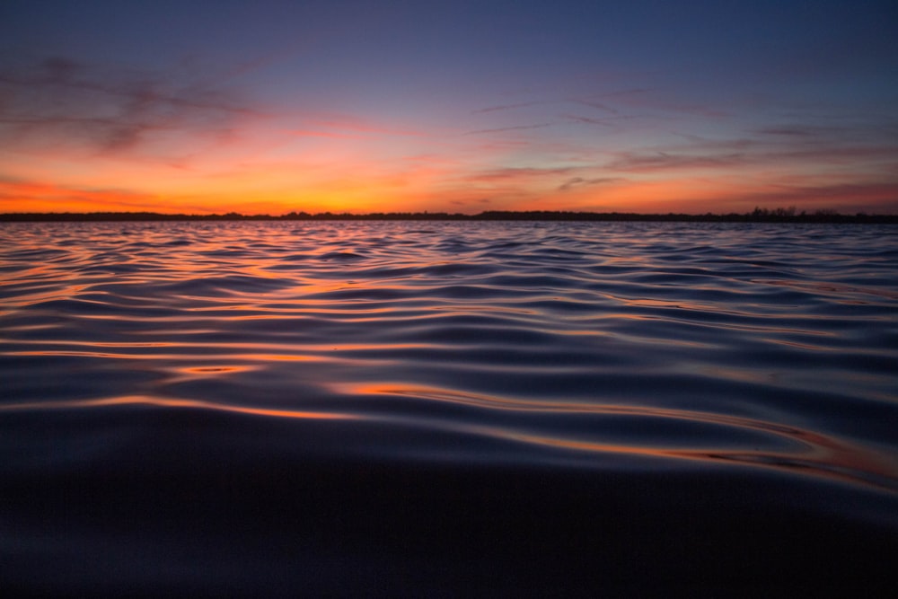 body of water during golden hour landscape photography