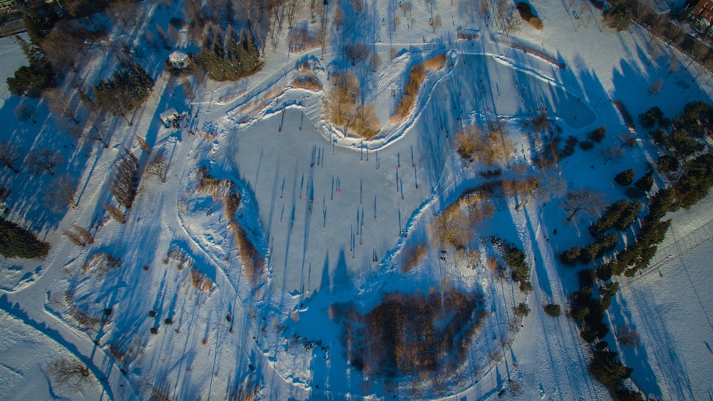 an aerial view of a snow covered park