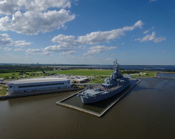 gray ship beside building