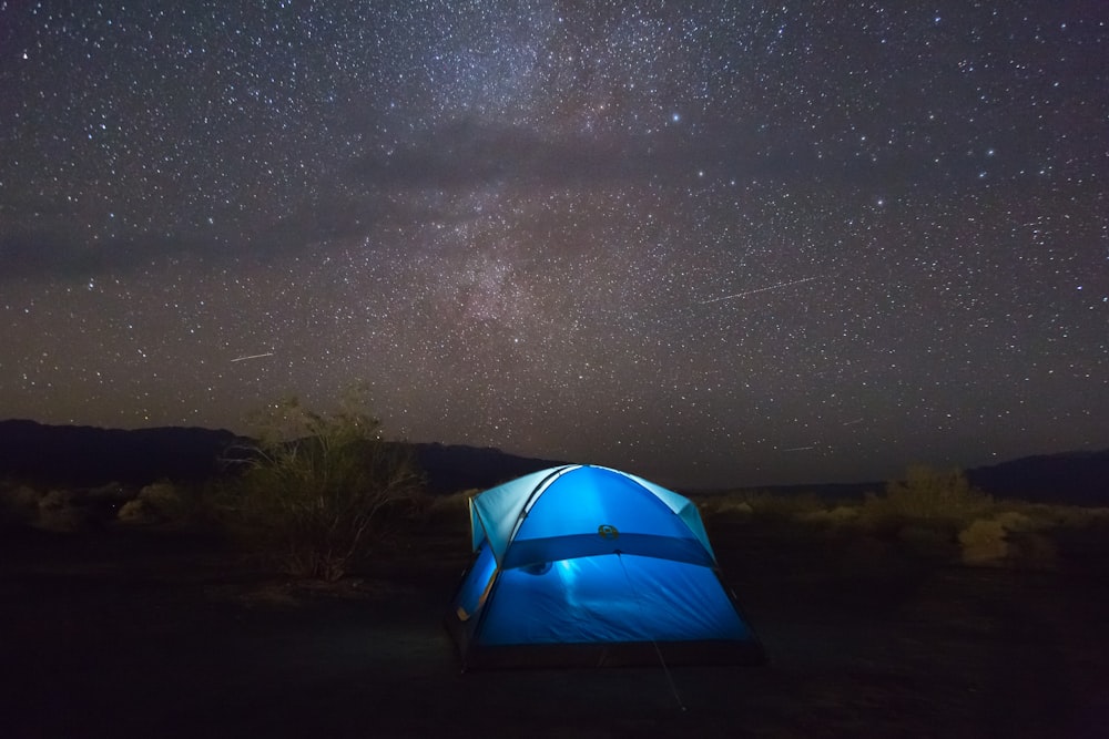 blue tent under starry sky