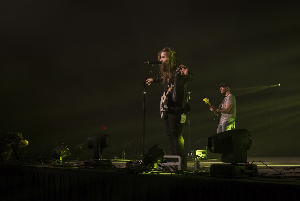 man and woman performing on stage