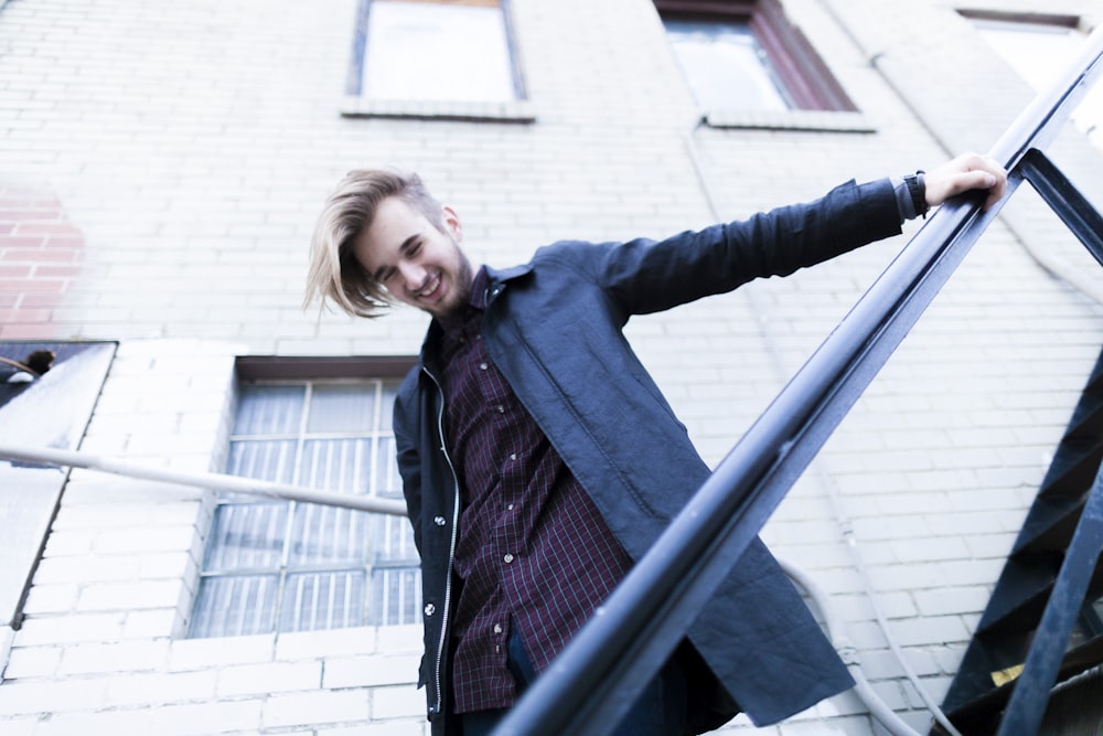 man standing on stairs