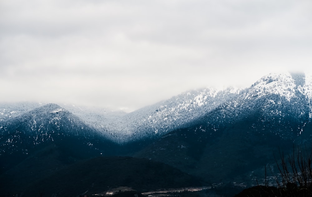 snow cap mountain under cloudy sky at daytime