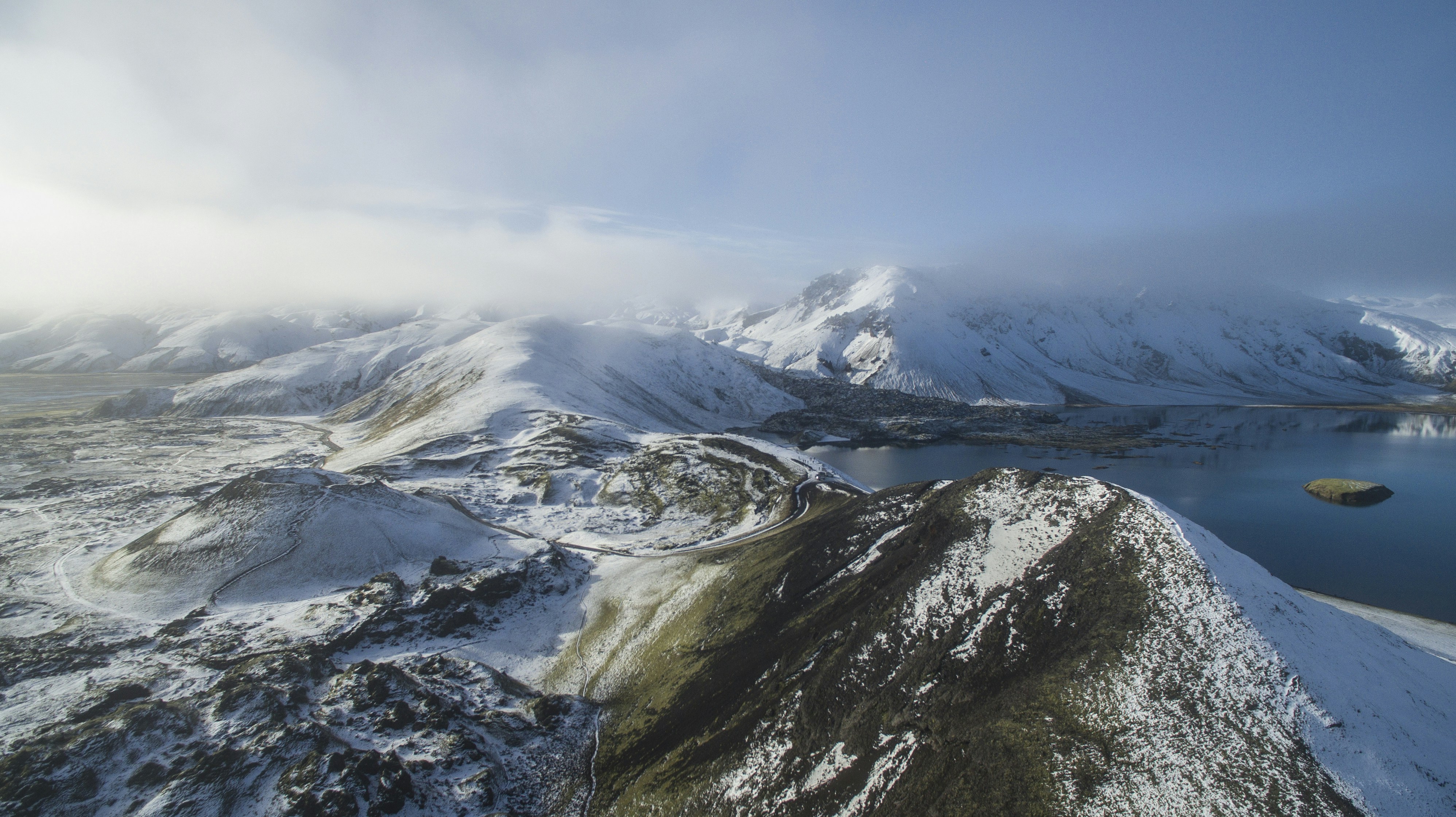 aerial view photography of snow mountain near lake