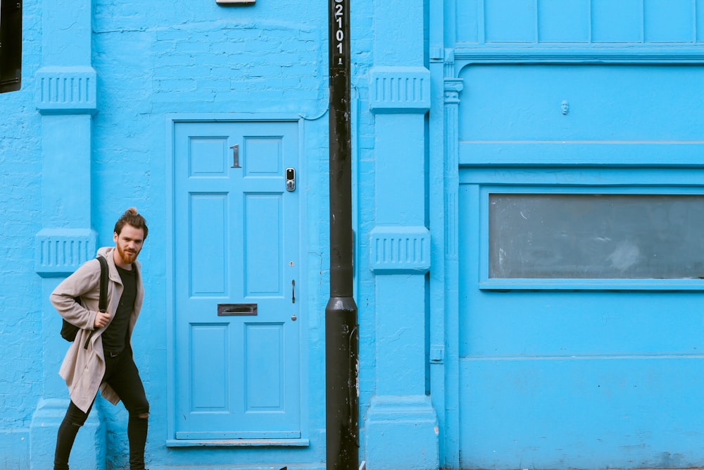 man passing through the door during daytime