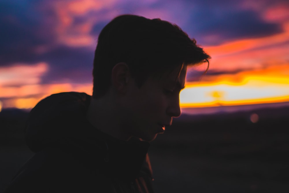 silhouette of man during sun set