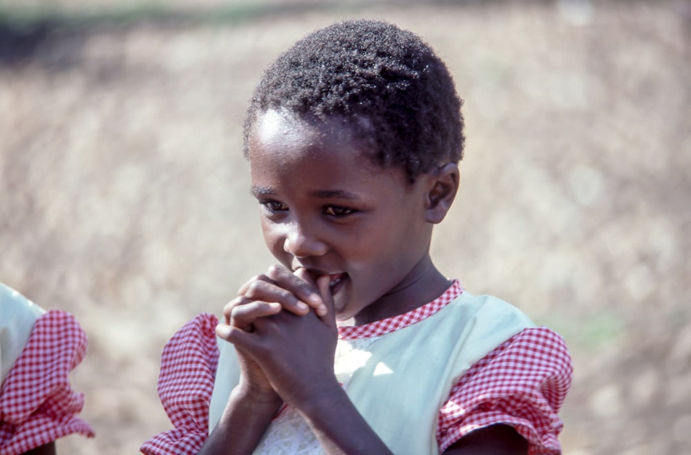 selective focus photography of girl on white and red dress