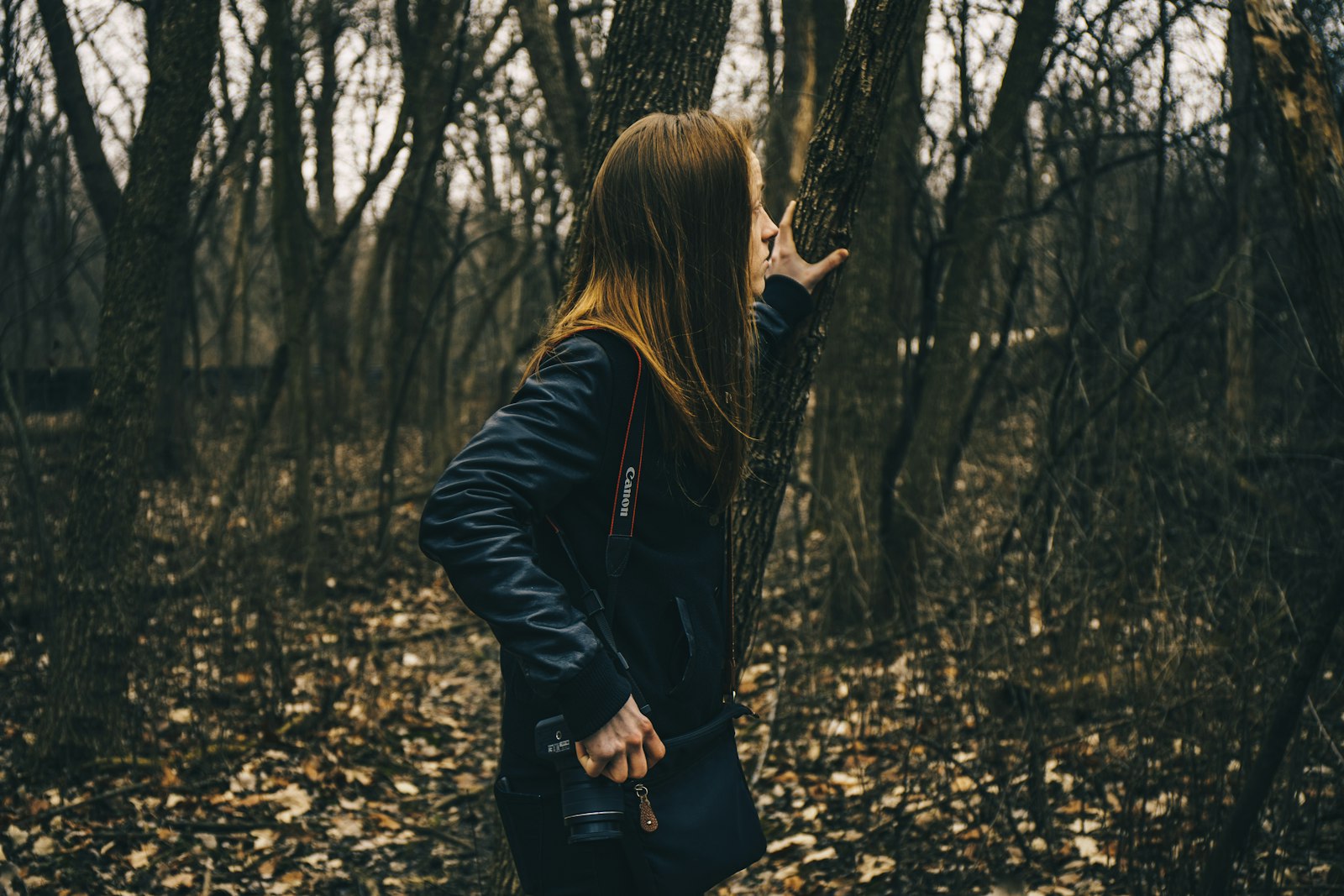 Sony a7 II + Canon EF 24-70mm F4L IS USM sample photo. Woman in forest holding photography