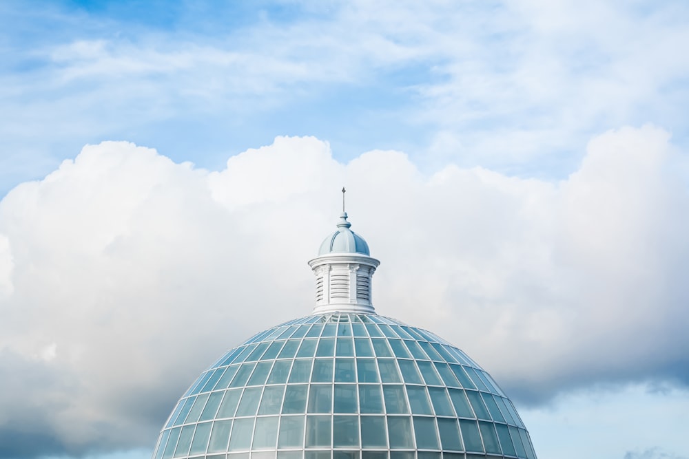 green and white dome tower under white and blue sky at daytime