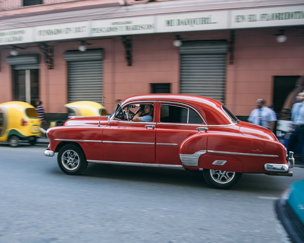 red sedan on the road