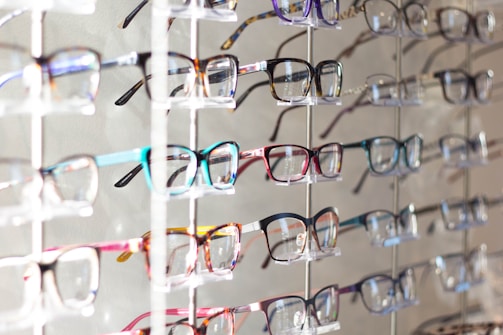 Display of various eyeglass frames arranged neatly