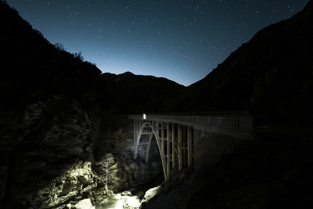 gray bridge under night sky