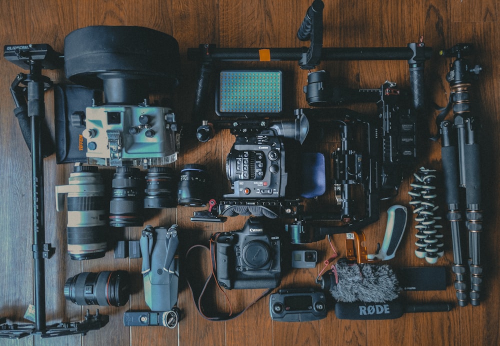 flat lay photography of cameras and camera gear