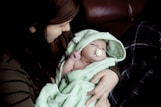 woman carrying baby