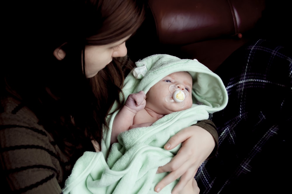 woman carrying baby