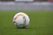 white and gray Adidas soccerball on lawn grass