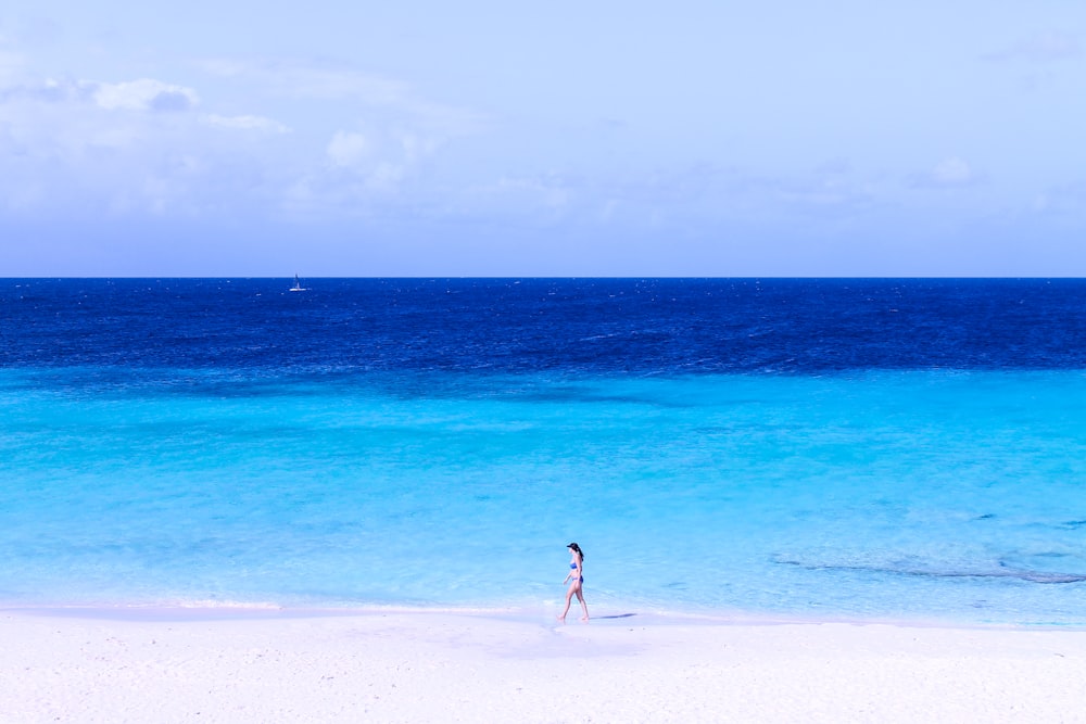 woman walking on seashore