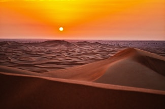 sand dunes during sunset