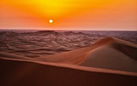 sand dunes during sunset