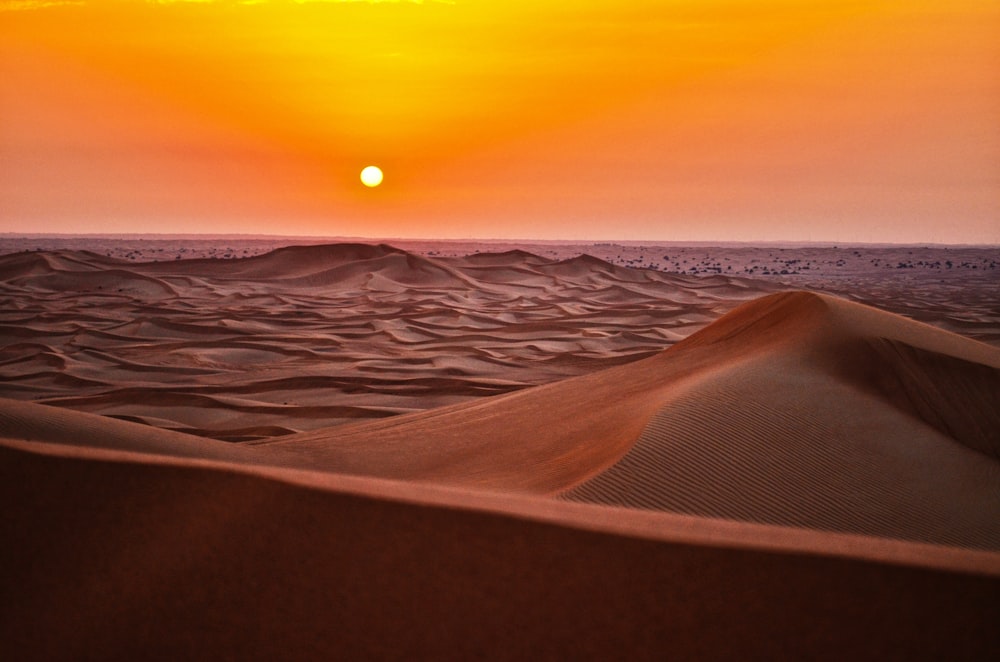 sand dunes during sunset