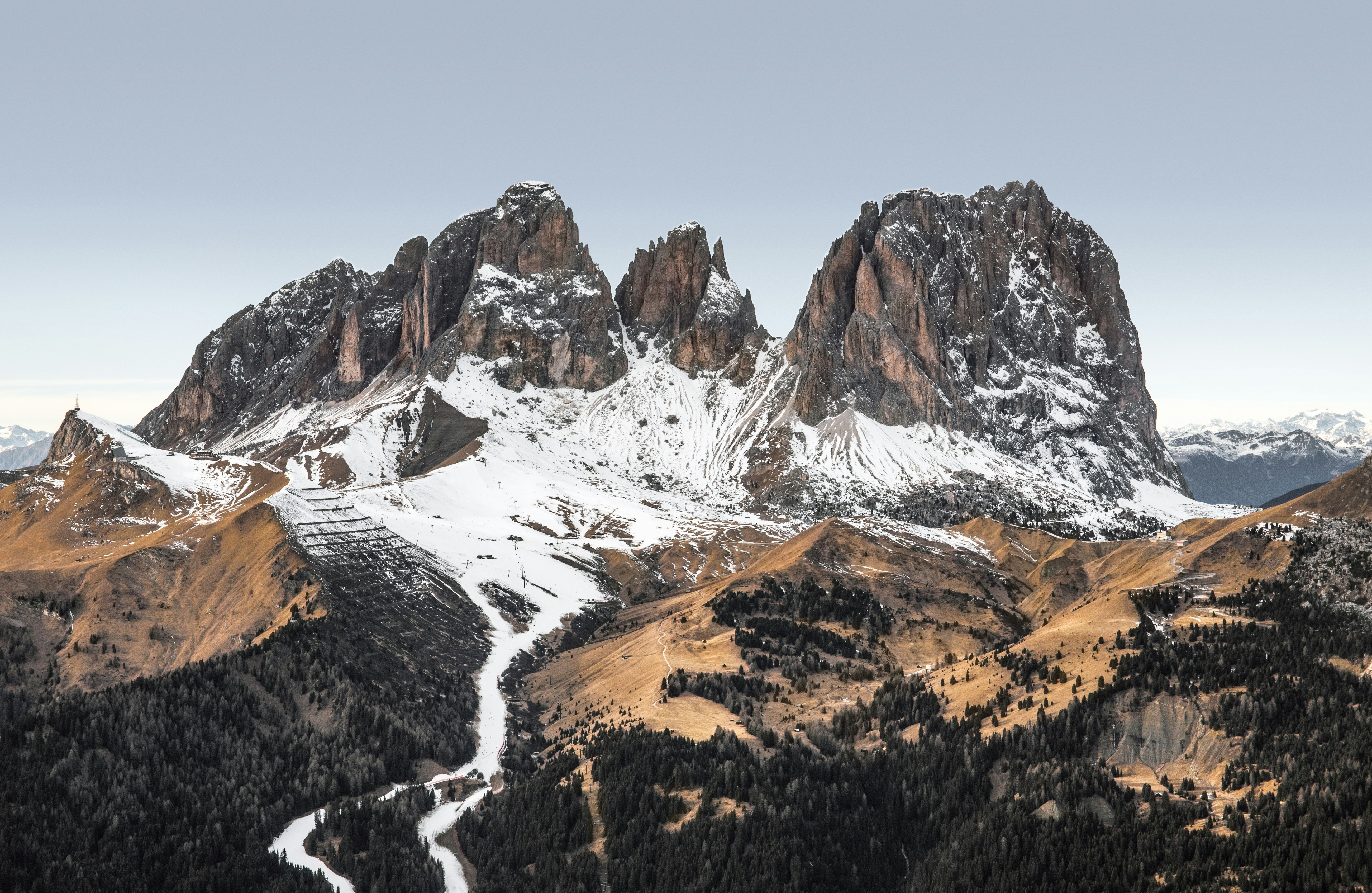 photo of snow covered mountain under clear blue sky