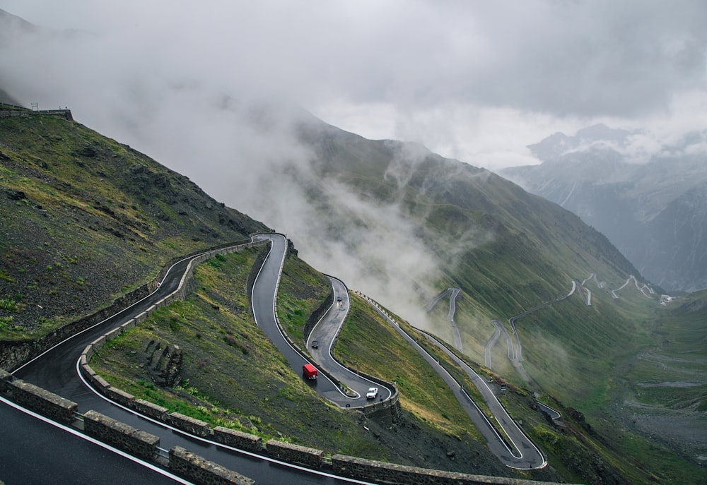 red car on zigzag road