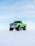 green off-road vehicle on snow during winter season